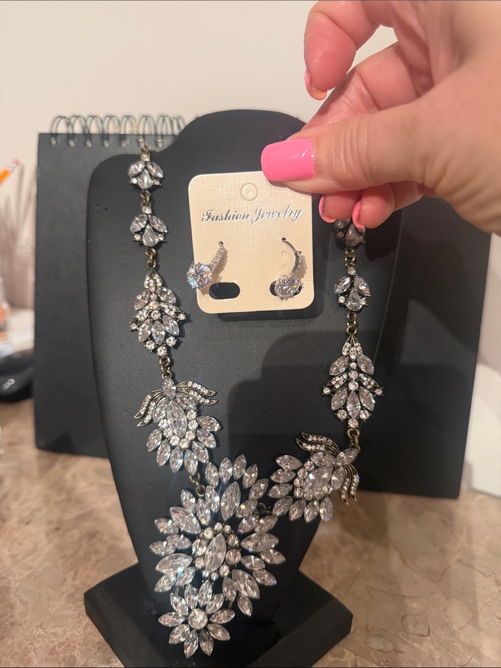 a beautiful rhinestone necklace with earrings